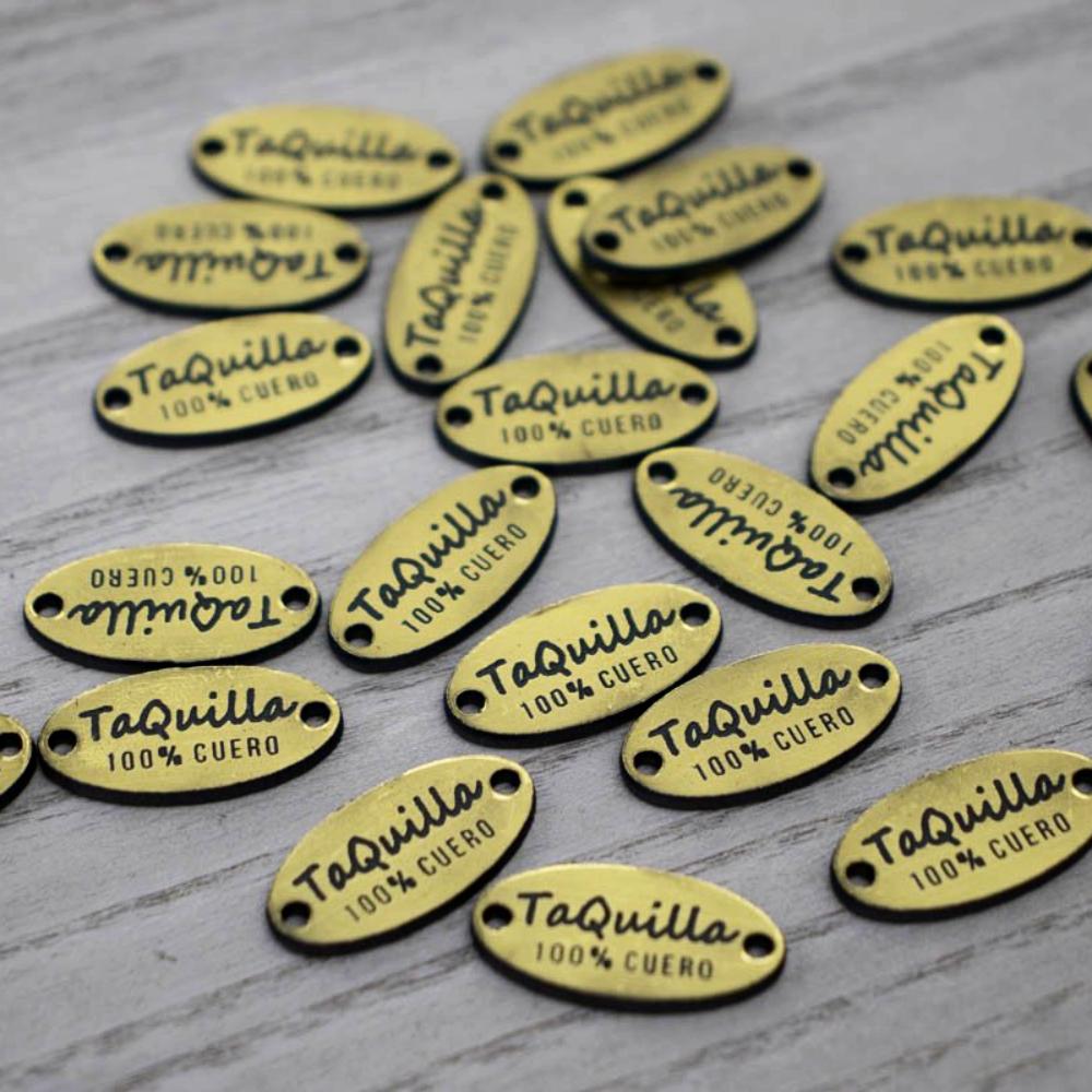 100 Etiquetas Metalizada Dorada/Negro Ovalada - Dos Perforaciones - Etiquetas Bicolor - Altorrelieve Diseño