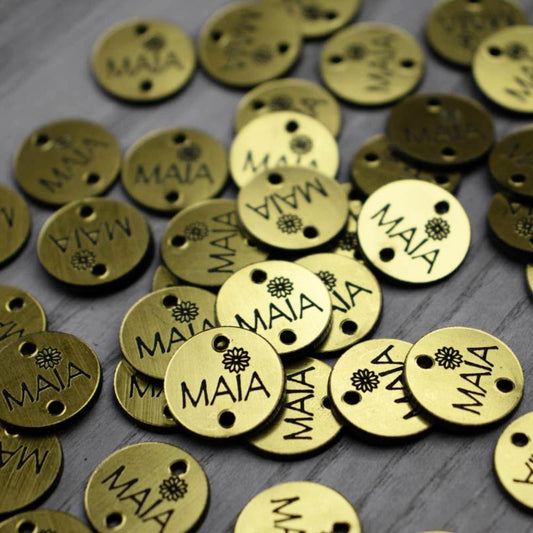 100 Etiquetas Metalizada Dorada/Negro Circular - Dos Perforaciones - Etiquetas Bicolor - Altorrelieve Diseño